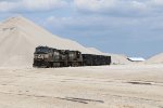 A pair of NS Dash-9's wait under the piles of stone at White Rock Quarry